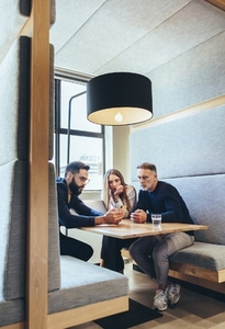 Group of businesspeople working in a co working space