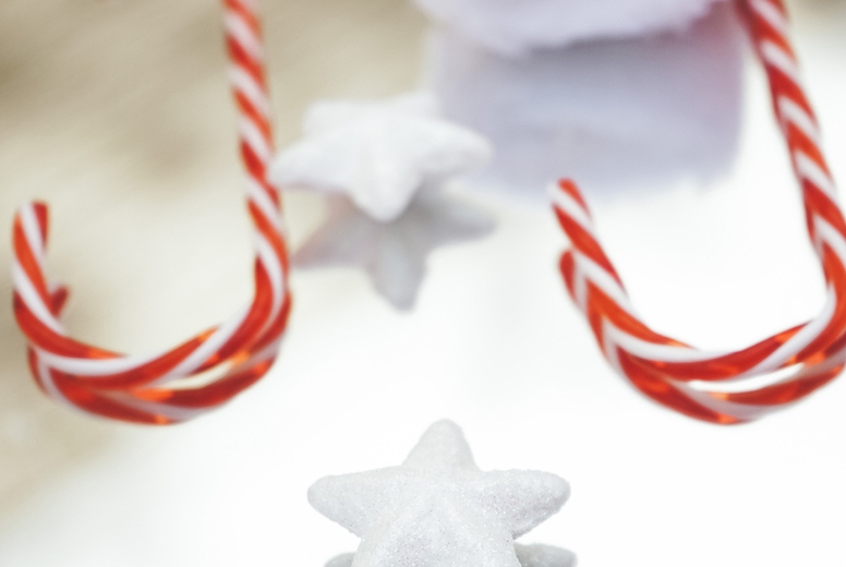 Reflected image of christmas classic decorations with candy cane