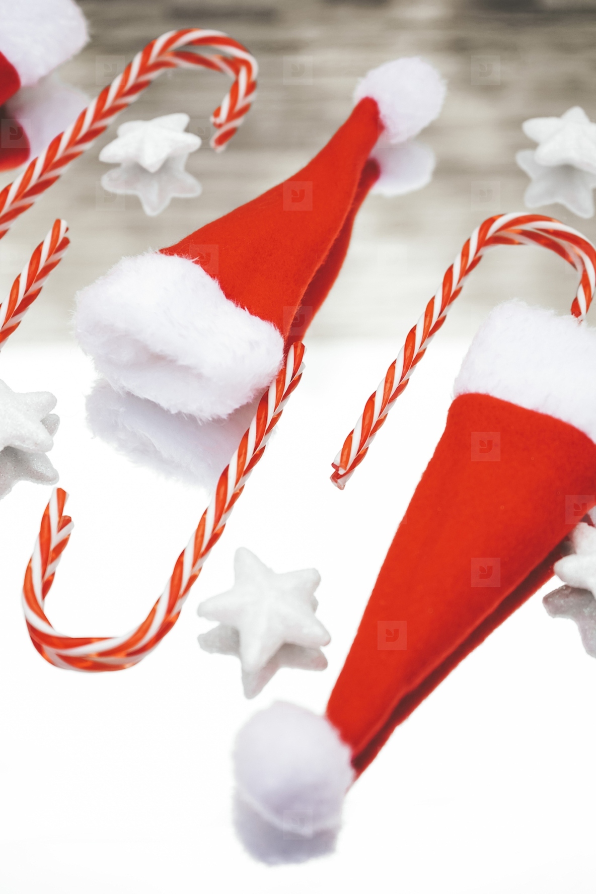 Reflected image of christmas classic decorations with candy cane
