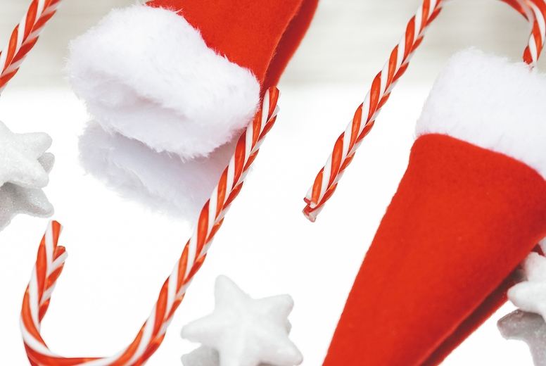 Reflected image of christmas classic decorations with candy cane