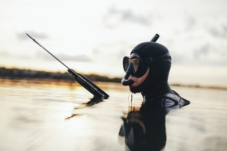 Diver hunting for fish using a speargun