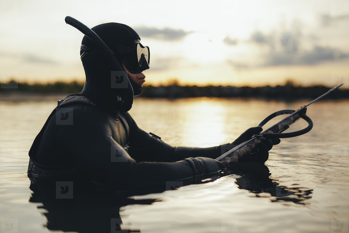 Young spearfishing in the sea