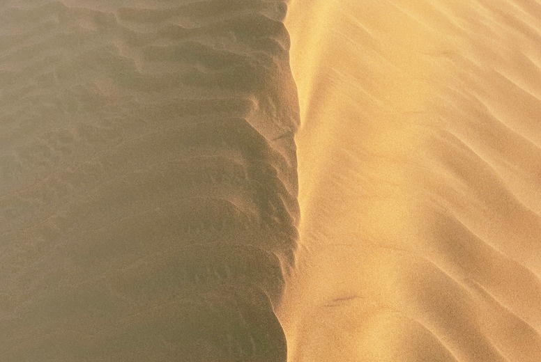 Shot from above of a center of a dune with patterns