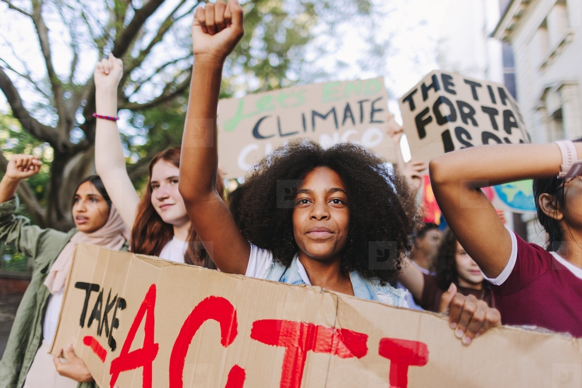 Multiethnic teenagers marching against climate change