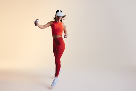 Young woman working out in virtual reality