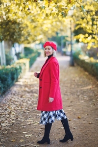 Positive woman in an autumn urban park