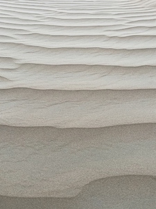 Close up of a natural pattern on a white dune sand
