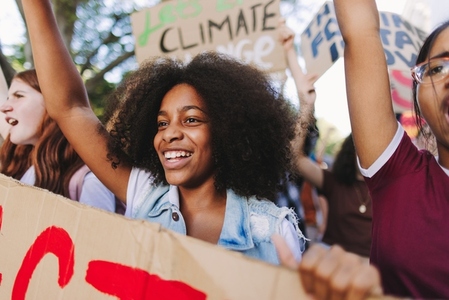 Happy young people standing up against climate change and global warming