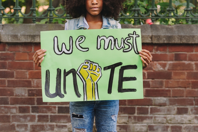 Young black girl campaigning for unity