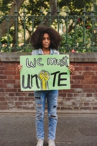 Young black girl campaigning for unity