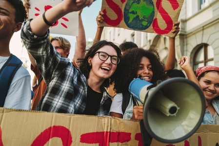 Happy youth activists protesting against climate change