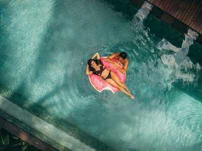 Couple enjoying vacation in resort pool