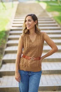 Glad woman standing near stairs