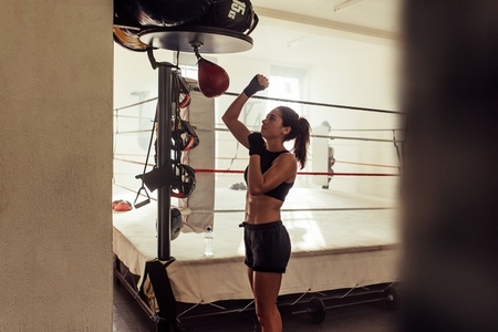 Female athlete training in a boxing gym