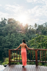Woman at luxury resort looking at beautiful view