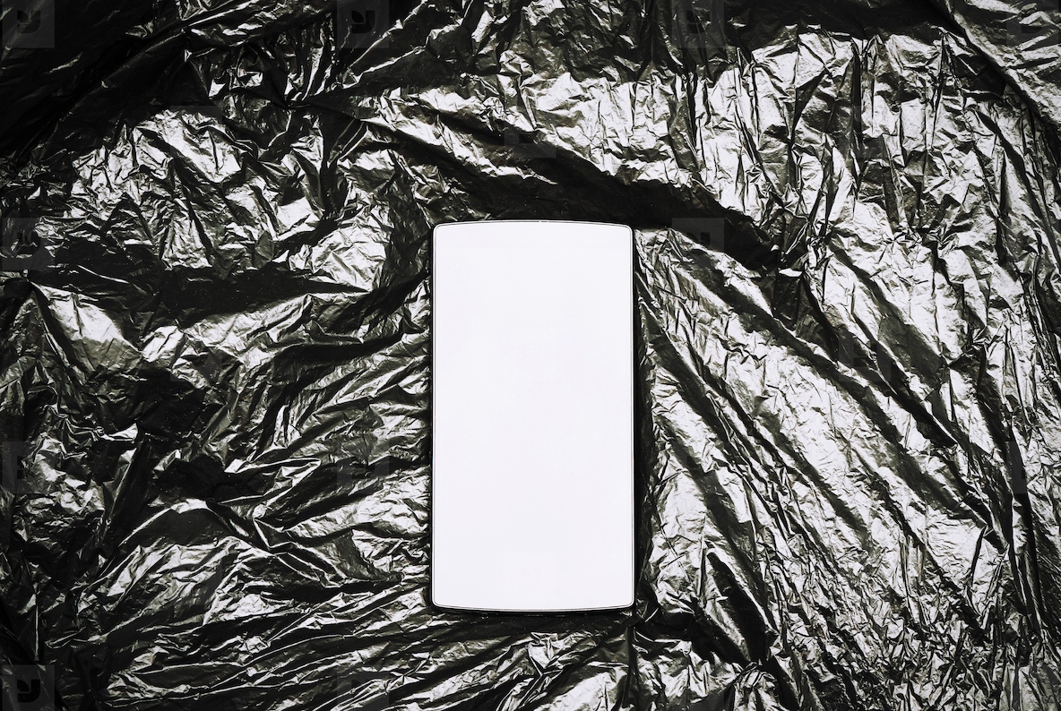 Dark mock up of a smart phone screen against a black plastic bac