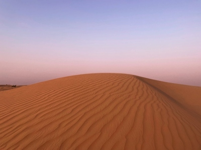 Big dune in the desert at sunset