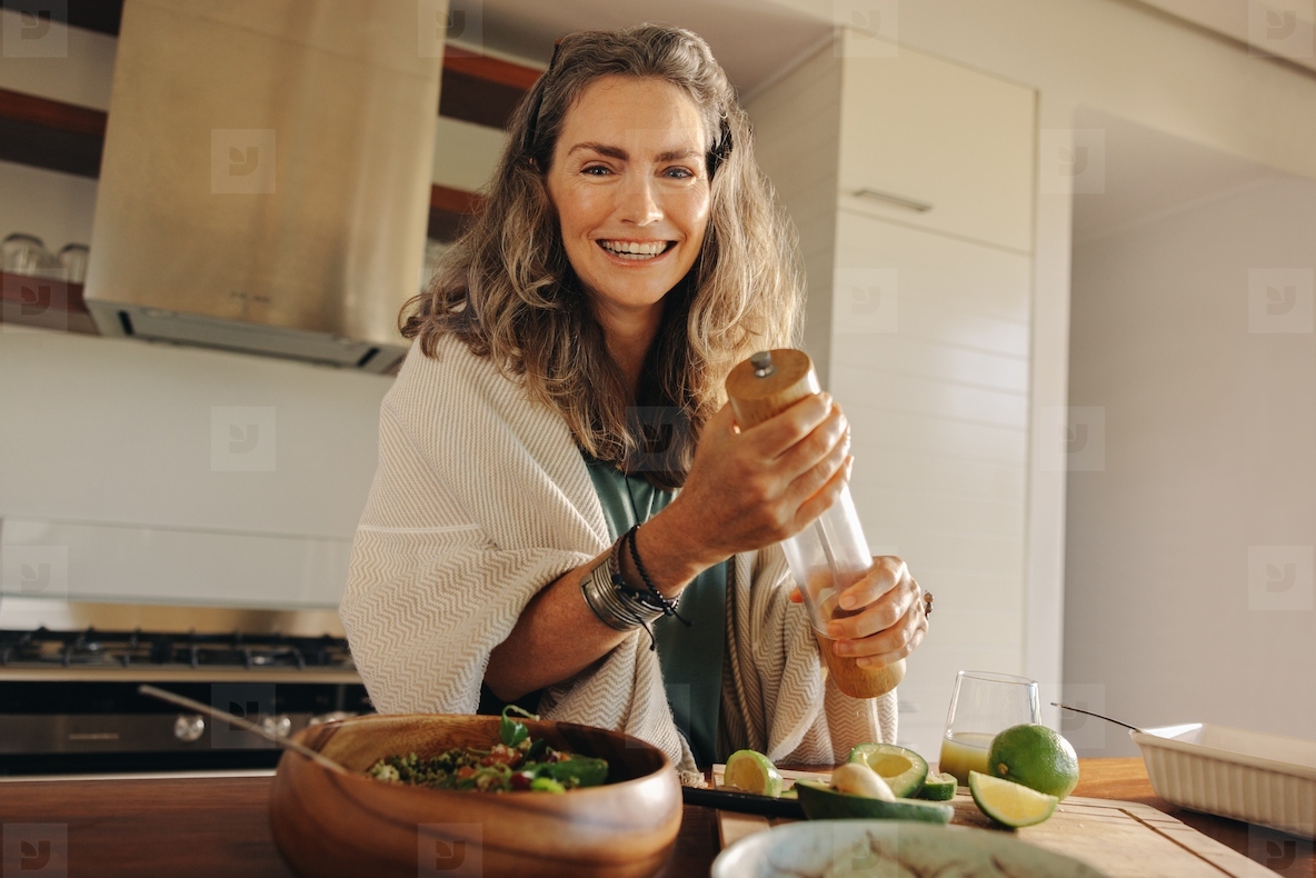 Vegetarian woman preparing a wholeseome plant-based meal at home