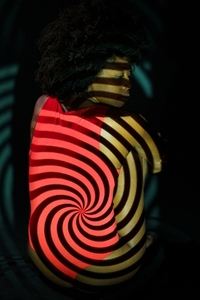 Black woman under spiral projection