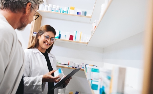 Pharmacists picking prescription medication in a chemist