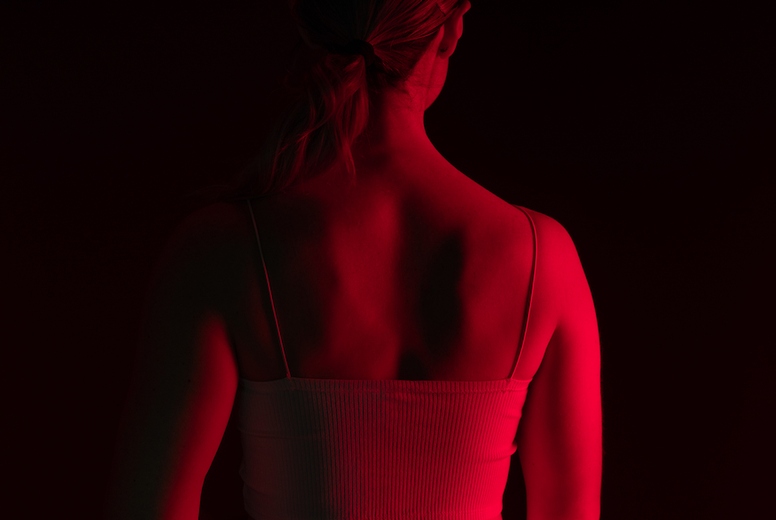Woman getting red light therapy on her back