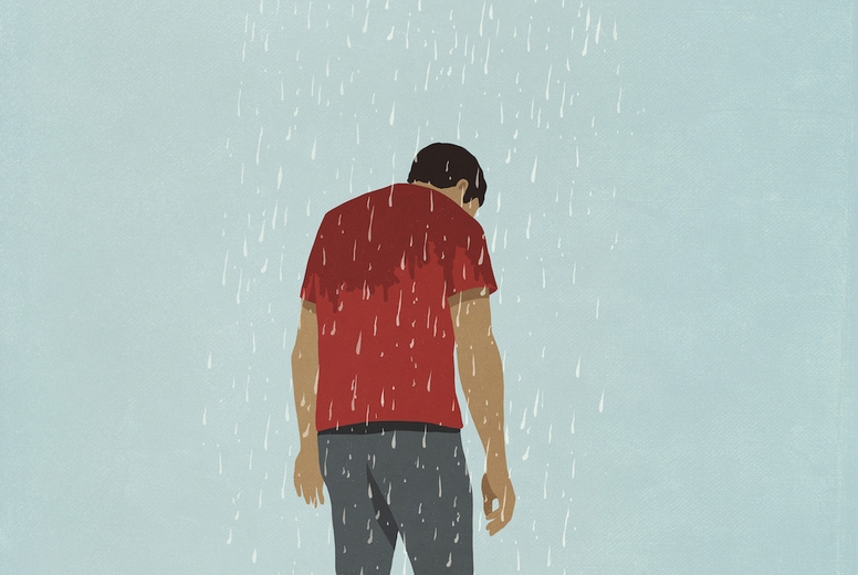 Rain cloud over depressed man