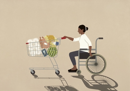 Woman in wheelchair pushing groceries in shopping cart