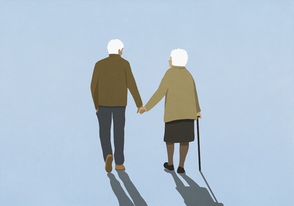 Affectionate senior couple walking on blue background