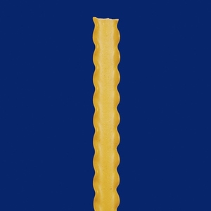 Close up still life raw reginette pasta with ruffled edges on blue background