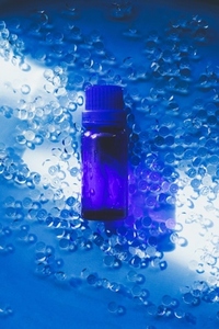 Blue bottle against blue water 1