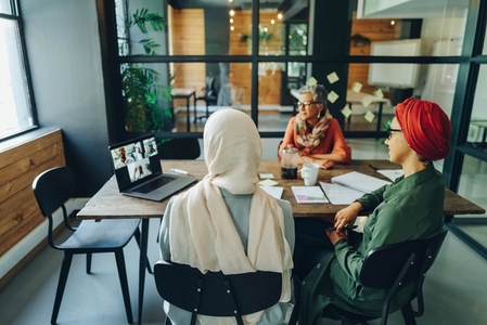 Businesswomen having a virtual meeting in an office