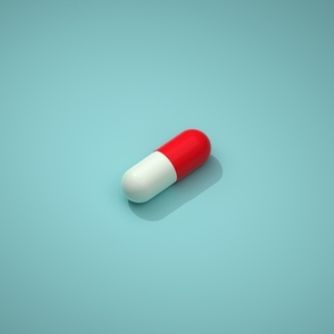 Pill with a white and red part on a blue background  Capsule lying on a blue background  3d render  3d illustration