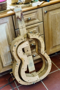 Wooden mould for making Spanish flamenco guitar in luthier workshop