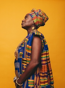 Elegant African woman wearing cultural clothing in a studio