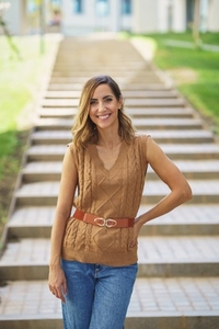 Cheerful stylish woman standing near steps