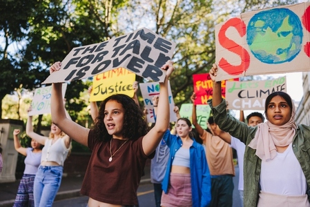 Group of teenagers standing up against climate change