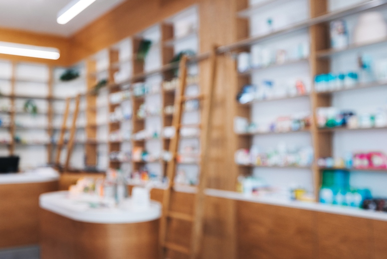Drug store interior with shelves of medication