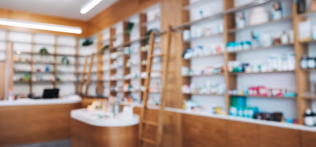Drug store interior with shelves of medication