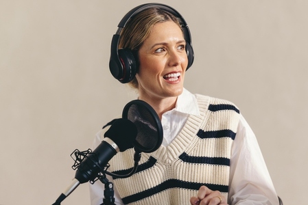 Woman hosting a radio show in a studio