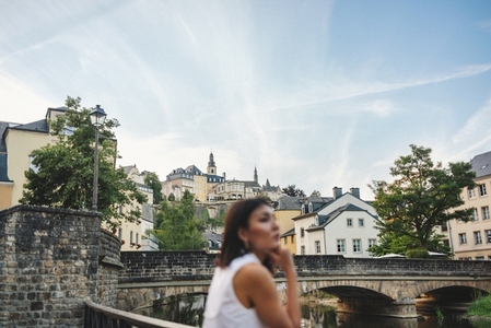 Female tourist standing on a bridge in Luxembourg Old Town