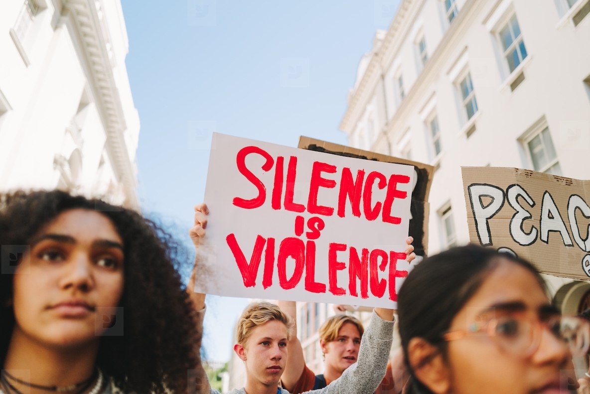 Diverse young people standing up against war and violence