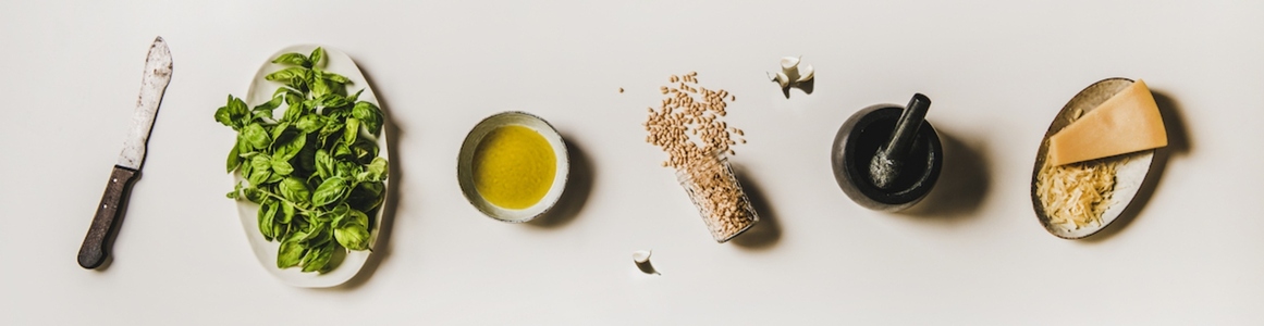 Ingredients for cooking Italian Pesto sauce over white background