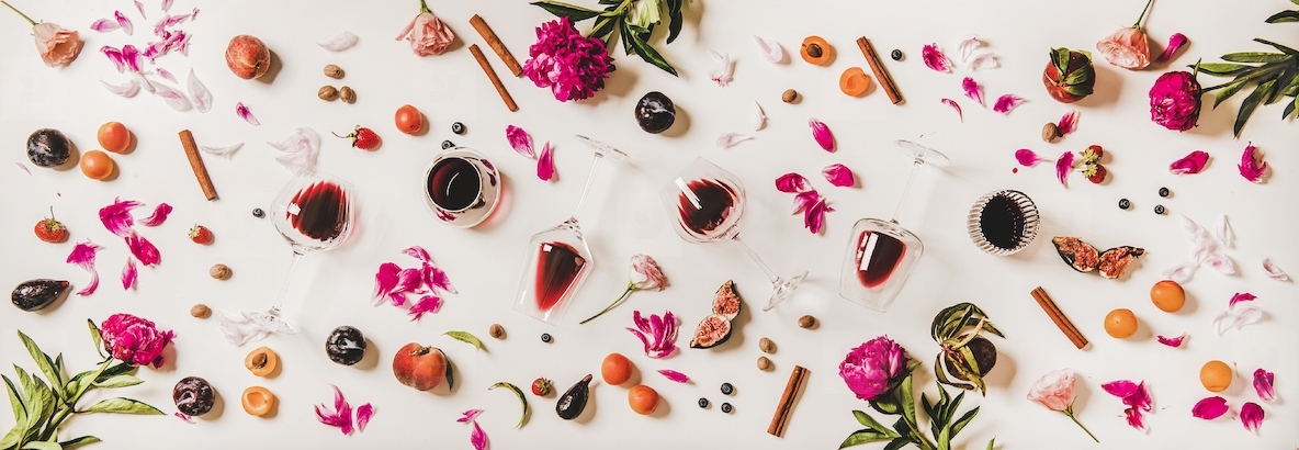 Flat lay of red wine in glasses with wine flavours symbols