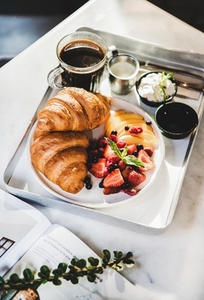 French breakfast with croissant  berries and coffee in cafe