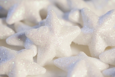 Many white stars covering with glitter for christmas decoration