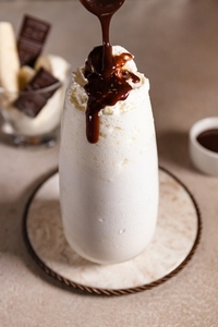 Milkshake with pouring chocolate