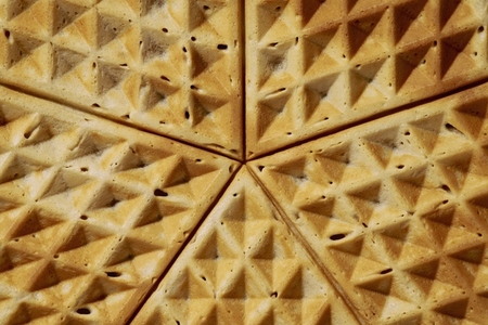Extreme close up textured corners of waffles