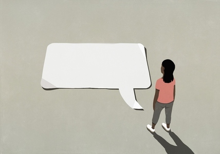 Woman looking down at communication speech bubble
