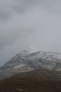 Clouds over snowcapped mountain Assynt 02