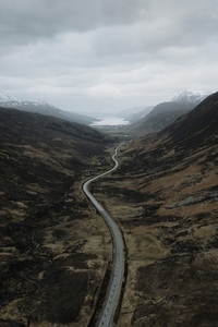 Winding road through remote hills in majestic landscape